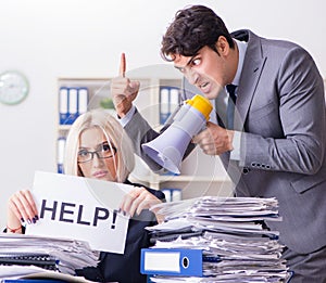 Angry boss yelling at his assistant secretary