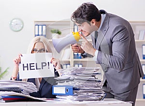 Angry boss yelling at his assistant secretary