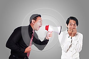 Angry Boss Yelling to His Worker With Megaphone