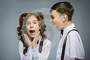 Angry boy shouting at frightened dissatisfied girl. Negative human emotion, facial expression. Closeup. Communication