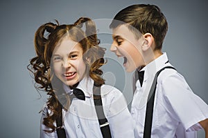 Angry boy shouting at frightened dissatisfied girl. Negative human emotion, facial expression. Closeup. Communication