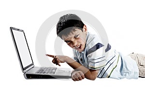 Angry boy using a laptop