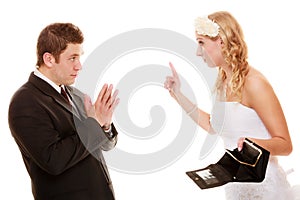 Angry bride with empty purse and groom quarrelling