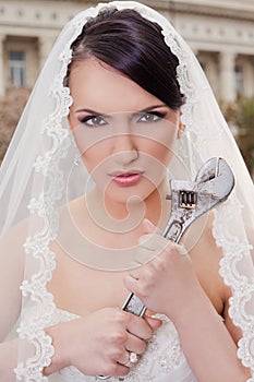Angry bride holding wrench