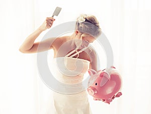 Angry bride with knife in hand about to smash piggy bank