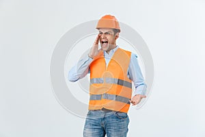 Angry builder or constructor yelling at somebody as fury concept isolated on white background with copyspace.