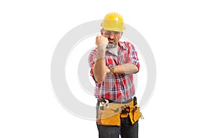 Builder showing fist as obscene gesture photo