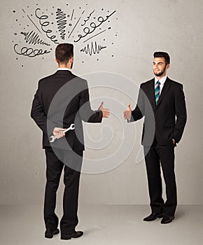 Angry business handshake concept