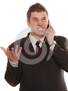 Angry business man talking on phone.