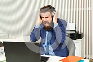 Angry business man working online office. Bearded furious businessman in suit shouting. Negative human emotions and facial