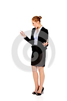 Angry business woman yelling to the mobile phone