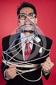 Angry businessman all tied up