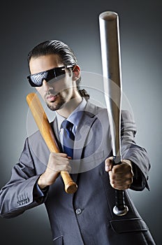 Angry businessman with bat