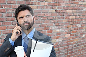 Angry businessman calling by phone