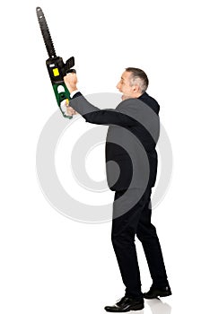 Angry businessman with chainsaw