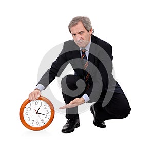 Angry businessman and clock