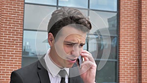 Angry Businessman Fighting on Phone Call