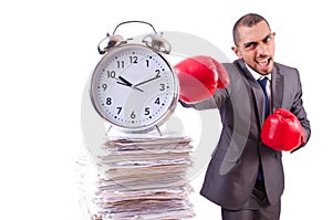 Angry businessman hitting clock isolated