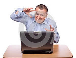 Angry businessman at laptop