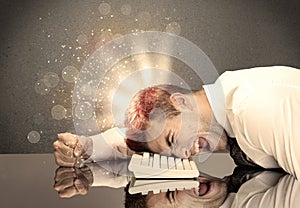 Angry businessman with lights and keyboard