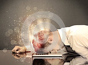 Angry businessman with lights and keyboard