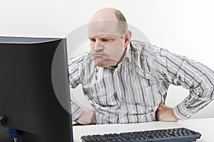 Angry Businessman Looking At Computer In Office