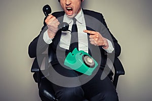 Angry businessman on the phone