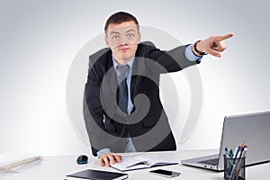 Angry businessman pointing front