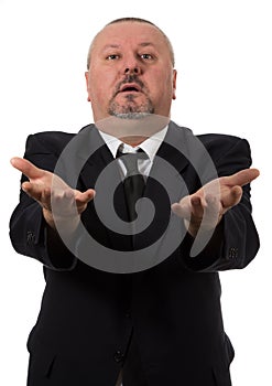 An angry businessman points at the camera