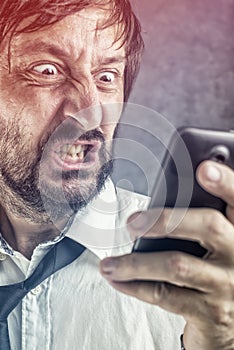 Angry businessman received frustrating SMS message photo