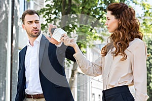 angry businessman refusing interview female journalist