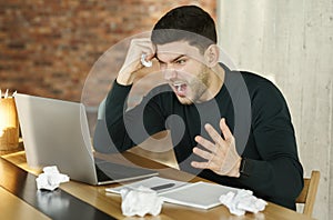 Angry Businessman Shouting Crumpling Paper Sitting In Modern Office