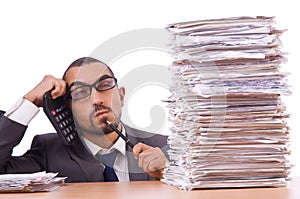 Angry businessman with stack