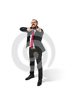 Angry businessman threatening and pointing to camera. on white.