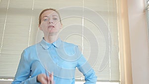 Angry businessmen, man and woman in the office, screaming at the camera close-up