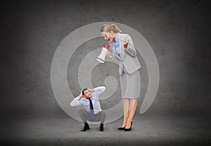 Angry businesswoman with megaphone