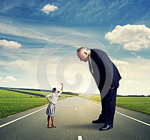 Angry businesswoman screaming at man