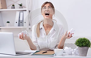 Angry Businesswoman Shouting Crumpling Paper Sitting In Office