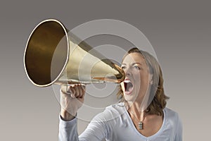 Angry Businesswoman Shouting Through Megaphone