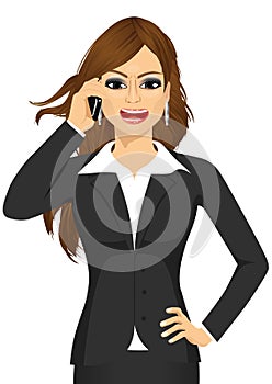 Angry businesswoman talking on mobile phone