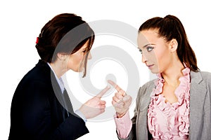 Angry businesswomans pointing on each other.