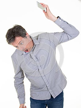 Angry caucasian man frustrated and furious with his phone conflict with customer service over white background