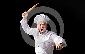 Angry Chef Bakerman Raising Rolling Pin Threateningly, Studio Shot