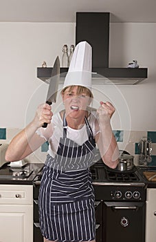 Angry chef holding a large knife