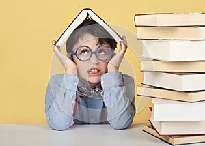 Angry child with books