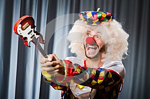 Angry clown with guitar