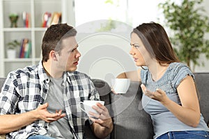 Angry couple arguing at home photo