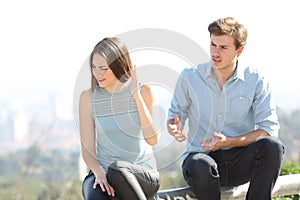 Angry couple arguing outdoors photo
