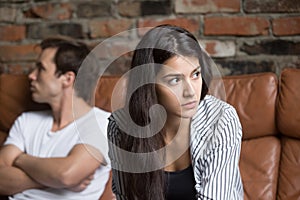 Angry couple avoiding talking after family fight