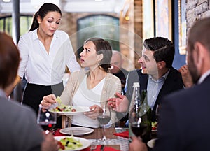 Angry couple conflict with waitress